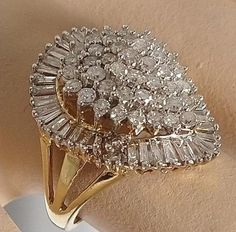 "This ring is gorgeous! It is from an Estate in New York City. The owner was an actress in the New York Theatre, and loved large diamond rings. This definitely fits the bill! It is a \"Ballerina\" design ring. The description of a Ballerina ring is \"fanciful and a distinctive style of gems\" in this case Diamonds! The cluster of Diamonds in the center simulates the flowing movement of a Ballerina dancing, and creates a swirling effect of Diamonds on the finger. Baguettes are usually used in thi Yellow Gold Cluster Diamond Ring For Anniversary, Yellow Gold Diamond Cluster Ring For Anniversary, Anniversary Yellow Gold Cluster Diamond Ring, Pear-shaped Diamond Cut Cluster Ring For Wedding, Heirloom Pear-shaped Diamond Cut Ring, Vvs Clarity Pear-shaped Diamond Ring For Anniversary, Yellow Gold Cluster Ring With Diamond Cut, Fine Jewelry Pear-shaped Cluster Ring With Brilliant Cut, Fine Jewelry Anniversary Cluster Rings