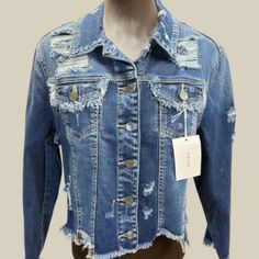 Cello Distressed Blue Denim Jean Jacket With A Button Up Front, Frayed Cuffs And Hemline. New W/Tags, In Excellent Condition. Available In Small, Medium, Large. Measurements: Small: Medium: Large: Chest: 32.5" 33" 34" Waist: 37" 39.5" 40" Length Of Garment: 18" 19.5" 19.5" Armhole: 19" 19" 20.5" Sleeves: 20" 21" Medium Wash Button-up Denim Jacket With Frayed Hem, Medium Wash Denim Jacket With Frayed Hem, Spring Denim Jacket With Frayed Hem, Denim Blue Button-up Jacket With Frayed Hem, Blue Denim Jacket With Button Closure For Spring, Blue Denim Jacket For Spring, Ripped Denim Blue Button-up Denim Jacket, Ripped Denim Blue Button-up Jacket, Spring Ripped Button-up Denim Jacket