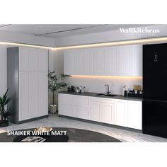 an image of a kitchen setting with white cabinets and black appliances in the center area