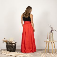 Indulge in timeless sophistication with our maxi cotton skirt, meticulously designed for both comfort and style. This high-waisted masterpiece boasts a gracefully tied bow on the waist, adding a touch of feminine allure. Available in a variety of colors, this skirt is a chic and versatile addition to your wardrobe, effortlessly blending fashion-forward trends with a classic silhouette.  Enjoy the effortless fit and the feminine sense when wearing our creations! Every piece by NikkaPlace is made Elegant Floor-length Voluminous Maxi Skirt, Elegant Voluminous Floor-length Maxi Skirt, Formal Voluminous Maxi Skirt, Elegant Pleated Full Skirt Maxi Dress, Elegant Maxi Dress With Pleated Full Skirt, Flowy Long Skirt Maxi Dress For Gala, Formal Red Flowy Maxi Skirt, Chic Voluminous Floor-length Skirt, Elegant Gathered Maxi Skirt