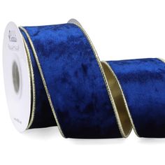 a roll of blue velvet ribbon with gold trim