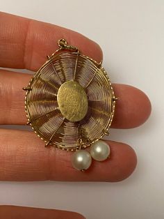 Vintage 14k yellow gold sun hat charm. The charm has two pearls. The charm weighs 2.59 grams of gold. Yellow Gold Brass Jewelry With Pearl Charm, 14k Yellow Gold Jewelry With Pearl Charm, Heirloom Style Yellow Gold Pearl Jewelry, Heirloom Yellow Gold Pearl Jewelry, Vintage Gold Jewelry With Akoya Pearl, Antique Gold Jewelry With Pearl Charm, Vintage Gold Akoya Pearl Jewelry, Vintage Akoya Pearl Pendant Jewelry, Victorian Gold Jewelry With Pearl Charm