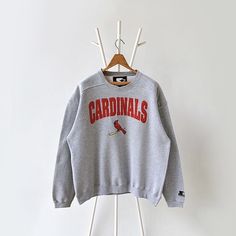 90s ST. Louis Cardinals MLB sweatshirt/ L * PLEASE READ BEFORE PURCHASE * PLEASE consider the PHOTOS before making the decision * The images may DIFFER in appearance from the actual product because we took pictures under daylight.  * PLEASE send your PHONE NUMBER after your purchase for the shipping company to contact you X No returns X No refund Condition : 8/10 More details : scratched (collar)/ look at the pictures  Brand : Starter Size : L Pit to pit/ Chests : 25/50 inches  Length : 28.5 inc Shipping Company, St Louis Cardinals, Cardinals, St Louis, Phone Number, Mlb, Sweat Shirt, Gender Neutral, Thailand