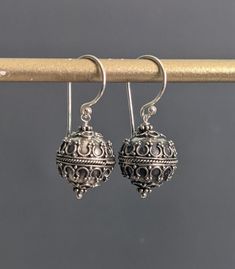 "Bali Oxidized Sterling Silver earrings with a teardrop design dangling from soldered ear wires. The earrings are approx: 1 1/4\" ( 32 mm.) long from the top of the ear wires. Bali Silver filigree beads: 13 mm. * Processing time is 3 - 5 days.  * US orders are shipped first class mail. * International orders are shipped first class international. * Shipping upgrades are available at checkout. Thank you for visiting my listing! Have a wonderful day!" Ornate Nickel-free Teardrop Dangle Earrings, Traditional Dangle Teardrop Earrings With Ear Wire, Adjustable Filigree Dangle Earrings, Ornate Drop Earrings For Gifts, Ornate Drop Earrings Gift, Ornate Teardrop Earrings With Ear Wire, Ornate Dangle Teardrop Earrings, Ornate Teardrop Dangle Earrings, Vintage Hypoallergenic Teardrop Earrings