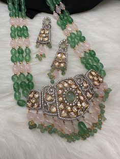 Kundan AD Green Stone Dual Tone Pendent Green Beads Mala Necklace Very pretty perfect green necklace Necklace Length : 20 Inches;  Earring Length : 2.25 Inches Approx. Push Back Ready to ship from Boston, MA If you have any questions please let me know. Thank You!! Green Pendant Necklace With Jewels, Green Faceted Beads Jewelry As Gift, Green Faceted Beads Jewelry For Gift, Green Beaded Bridal Necklace With Round Beads, Green Costume Jewelry Sets, Green Dangling Beads Necklace For Celebration, Green Necklaces With Dangling Beads For Celebration, Celebration Green Beaded Necklace With Colorful Beads, Green Dangle Costume Jewelry