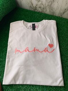 Look good and feel great in the Mama T-shirt! This unique t-shirt is made from soft, breathable cotton and features an embroidered design that looks amazing. Whether you're dressing up or dressing down, you'll stay comfortable while making a statement. What are you waiting for? Get your Mama T-shirt today! Beautiful embroidered T-shirt to celebrate every “Mama” Trendy Crew Neck T-shirt With Embroidered Text, White Casual Tops With Custom Embroidery, White Casual Top With Custom Embroidery, Trendy Cotton T-shirt With Custom Embroidery, Cotton T-shirt With Embroidered Text, Crew Neck, Cotton T-shirt With Embroidered Graphics, Cotton T-shirt With Embroidered Graphics, Crew Neck, Casual Crew Neck T-shirt With Custom Embroidery, Pink T-shirt With Embroidered Text For Summer