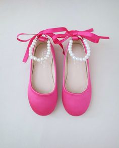 Satin flats with gorgeous row of pearls and rhinestones ankle strap for comfort and simple chic style. Perfect flower girls, birthday party, holiday, formal wear, or to match with your fall outfit. DETAILS: COLORS AVAILABLE: Black, Burgundy, Champagne, Fuchsia, Dusty Pink, Hunter Green, Ivory, Lavender, Light Blue, Navy, Red, White UPPER: Synthetic upper and lining MATERIALS: Manmade outsole ORIGIN: Imported STYLE NAME: HARPER Not sure of which size to purchase? Shoes measurements are as follow: (Please note measurements taken the length of inside of shoe from toe to heel) KIDS SIZES: Walker: - Size 4: 4.85 inches - Size 5: 5.15 inches - Size 6: 5.5 inches Toddler: - Size 7: 5.85 inches - Size 8: 6.15 inches - Size 9: 6.65 inches - Size 10: 6.85 inches - Size 11: 7.35 inches - Size 12: 7.5 Pink Kid Heels, Kids Pink Heels, Pink Satin Mary Jane Heels, Fall Flower Girl, Flower Girls Shoes, Simple Chic Style, Birthday Shoes, Flower Girl Shoes, Holiday Shoes