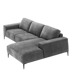 a large gray couch sitting on top of a white floor