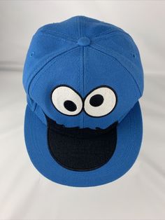 Cookie Monster Official Sesame Street Blue Baseball Cap Fitted Size S / M Hat. Some wear on inside head band Blue Hip Hop Baseball Cap, Playful Snapback Baseball Cap For Streetwear, Fun Blue Snapback Hat With Flat Brim, Blue Fun Style Snapback Hat, Blue Streetwear Hat One Size, Blue Flat Bill Hat For Streetwear, Blue Fitted Cap For Streetwear, Blue Flat Brim Hat For Streetwear, Blue Baseball Cap For Streetwear