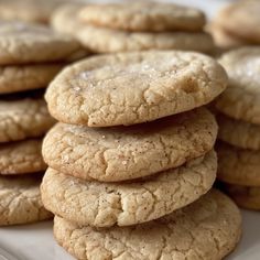 a pile of cookies sitting on top of a white plate