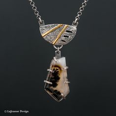 Marfa Plume Agate Sterling Silver Chain Necklace, Mixed Metal Necklace, Statement Necklace, Pendant, 18K Gold The feature stone is a Marfa Plume Agate stone. It has wire prongs holding it so you can see through the sides. Above it sits a three-dimensional silver piece, that is accented with 18K gold. The solid sterling silver chain is 18-inches with two 18K gold rings. I have applied a scratch finish to the silver for an old world look. The silver has been oxidized (blackened). The back has the Elegant Agate Necklace With Large Pendant, Artisan Agate Jewelry With Polished Finish, Modern Chalcedony Jewelry With Polished Finish, Formal Agate Pendant Jewelry, Elegant Wire Wrapped Chalcedony Jewelry, Gold Agate Jewelry With Polished Finish, Elegant Agate Jewelry With Large Stone, Unique Silver Agate Necklace, Unique Chalcedony Pendant Necklace