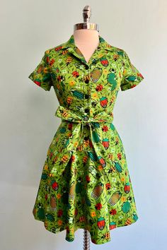 Short Sleeve Belted Dress For Garden Party, Casual Green Belted Dress, Green Fitted Dress With Tie Waist, Vintage Green Collared Dress, Fitted Green Dress With Tie Waist, Green Belted Dress For Garden Party, Green Buttoned Dress For Garden Party, Green Short Sleeve Cotton Dress, Green Cotton Short Sleeve Dress