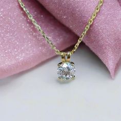 Elegant 1.00 carat round moissanite pendant in a 14k solid gold 4-prong basket setting. A timeless necklace, perfect for everyday wear or as a thoughtful anniversary gift. ✥𝐒𝐭𝐨𝐧𝐞 𝐃𝐞𝐭𝐚𝐢𝐥𝐬 → Shape: Round  → Stone Type: Moissanite Diamonds → Weight: 1.00 Carat → Color: D (Colorless) → Clarity: VVS → Polish: Excellent → Symmetry: Excellent → Luster: Excellent → Make: High Quality 𝐍𝐨𝐭𝐞: The chain is not included; we can provide it for you upon request. Please note that there will be a Timeless Solitaire Diamond Necklace Gift, Timeless Gift Solitaire Diamond Necklace, Timeless Solitaire Necklace With Prong Setting Gift, Timeless Solitaire Necklace With Prong Setting, Timeless Solitaire Necklace With Lab Grown Diamond, Timeless Solitaire Necklace With Lab-grown Diamond, Classic Moissanite Solitaire Pendant Necklace, Luxury Solitaire Diamond Necklace Gift, 14k Gold Round Solitaire Necklace