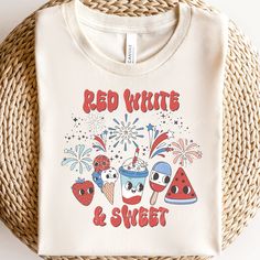 a red white and blue t - shirt with watermelon, ice cream, strawberries, and fireworks