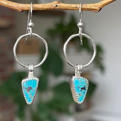 "These turned out so cute Each earring has a small shiny silver hoop with a bright blue Kingman turquoise dangle.  The perfect earring when you want just a little pop of color!  These are very lightweight and comfortable to wear. Measurements:  1.2\" x .6\" Weight: .11oz/3g each Turquoise is connected to the healing energy of water, the life-giving element that sustains the planet and the origins of life itself. This energy of renewal and rejuvenation is what gives the turquoise crystal meaning. Turquoise Metal Hoop Earrings, Unique Dangle Hoop Earrings For Everyday, Turquoise Sterling Silver Hoop Earrings For Pierced Ears, Unique Small Hoop Hypoallergenic Earrings, Unique Hypoallergenic Small Hoop Earrings, Bohemian Single Sterling Silver Earring, Hypoallergenic Small Hoop Earrings, Nickel-free Turquoise Dangle Hoop Earrings, Turquoise Dangle Hoop Earrings Nickel Free