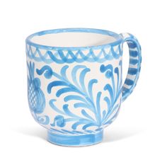 a blue and white coffee cup on a white background