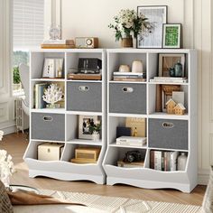 a white bookcase filled with lots of books