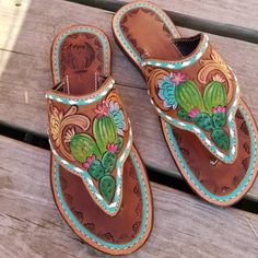 Tooled and painted handmade leather sandals! Tooled Leather Sandals, Western Sandals, Western Footwear, Custom Sandal, Flat Sandals Wedding, Saddle Shop, Flat Art, Sandals Wedding, Ankle Strap Sandals Flat