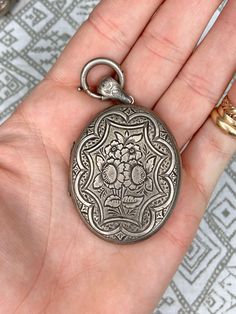 Antique Etched Sterling Silver Locket Necklace, Antique Sterling Silver Etched Locket Necklace, Antique Silver Stamped Victorian Jewelry, Victorian Style Stamped Antique Silver Jewelry, Victorian Antique Silver Stamped Jewelry, Ornate Engraved Locket Necklace Vintage Collection, Antique Etched Locket Necklace For Memorial, Victorian Engraved Locket Necklace For Memorials, Victorian Etched Medallion Locket Necklace