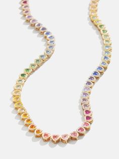 Our Kali collection just got another style that's sure to become one of your everyday favorites. The Kali Necklace features an eternity necklace band fitted with an ombre of heart-shaped rainbow crystals. It's the perfect pop of color to add to your collection. Ups Shipping, 18k Gold Necklace, Heart Shaped Jewelry, Rainbow Jewelry, Jewelry Accessories Ideas, Rainbow Beads, Rainbow Crystal, Jewelry Lookbook, Beaded Stretch Bracelet