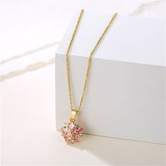 18k gold-plated chain with a flower pendant made o crystals and cubic zirconia makes this necklace an elegant addition. Chain : 15.72" L with 1.96" extender Pendant : 0.51" diameter Lobster claw clasp 18k gold-plated copper / crystal / cubic zirconia Copper Crystal, Cross Chain, Pattern Flower, Flower Pendant Necklace, Men's Necklace, Gold Plated Necklace, Pink Crystal, Flower Pendant, Diamond Studs