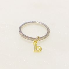 Shiny dainty ring with gold tone initial charm. Has beautiful details! CZs all around the ring, initial charm moves around and dangles very pretty! All rings in Size 7 Gold plated Brass Cubic Zirconia Lead and Nickel free Made in China Ring Initial, Chic Rings, Hair Setting, Pierced Jewelry, Initial Ring, Initial Charm, Dainty Ring, Scrunchie Hairstyles, Hair Accessories Headbands