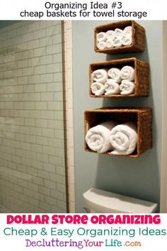 an organized bathroom with three baskets on the wall