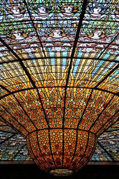 a very large stained glass ceiling in a building