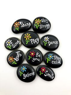 six painted rocks with the words shine, stay strong and be you