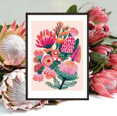 an art print with pink flowers and green leaves in front of a bouquet of other flowers