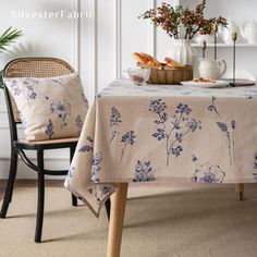 the table is covered with a blue and white floral design