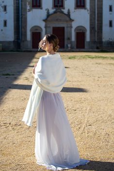 This ivory wedding shawl matches perfectly with off-white ivory dresses, but also brightens up darker or creamier wedding dress. It is a warm, off-white shade. Ivory and Pure White are both shades of white, but they differ in tone and warmth. Ivory has a subtle hint of warmth with a soft, creamy undertone. It tends to feel more organic and elegant. In contrast, Pure White is a clean, bright, and cool shade with no undertones of color, giving it a stark, crisp appearance. Pure White is often asso White Shawl, Bridal Shawl, Wedding Shawl, Ivory Dresses, Ivory Wedding, Shades Of White, Home Wedding, Pure White, Alpaca