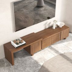 a wooden table sitting in front of a mirror on top of a white tiled floor