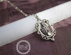 To see more unique designs please visit my website -  https://www.thesilverwing.com/collections/jasper-sky-studio  - purchases from my website means 100% goes to the artist, me. Introducing our enchanting Cicada Cameo Sterling Silver Necklace, a truly unique and elegant piece of nature-inspired jewelry that is sure to captivate and delight. This exquisite necklace features a beautifully detailed cicada and a shimmering rutilated quartz, both framed within a stunning cameo pendant. The perfect gi Cameo Pendant, Bezel Pendant, Nature Inspired Jewelry, Jewelry Unique, Unique Christmas Gifts, Rutilated Quartz, Christmas Gifts For Her, Site Web, Sterling Silver Necklace