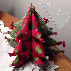 three christmas trees sitting on top of a table