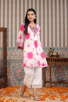 Indulge in elegance with our Pink Tie And Dye Suit Set. The beautiful pink hue and handwork make it the perfect statement piece for any occasion. Crafted from luxurious organza, the delicate tassels add a touch of charm to this unique and sophisticated ensemble. Elevate your wardrobe with this exclusive piece. No. of pieces - 2 piece set. Color - Pink. Kurta Fabric - Organza. Washing Instructions - Dry Clean. Pink Kurta, Pink Tie, Tie And Dye, Pink Ties, Suit Set, 2 Piece Set, Washing Instructions, Statement Pieces, 2 Piece