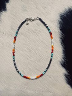 Our seed bead necklaces are made to order and can be made in several lengths. Please note shorter or longer lengths may slightly alter the pattern or how many stones are included. We use all hypoallergenic chain/cord and clasps. Please let us know if you have a pattern in mind that you don't see here! We are always open to do custom orders! All necklaces include 2 inches of chain to adjust the necklace if needed. Western Beaded Necklace Designs, Handmade Heishi Oval Beads, Handmade Oval Heishi Beads, Bohemian Beaded Necklace With Oval Beads For Festival, Bohemian Oval Beads With Beaded Chain, Bohemian Necklace With Oval Beads, Bohemian Oval Beads Necklace For Festival, Bohemian Oval Beaded Necklace For Festivals, Adjustable Heishi Beads Necklace With Gemstone