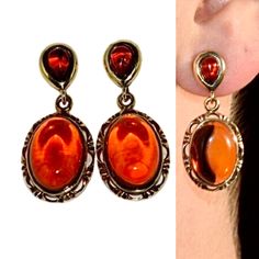 Fabulous drop earrings handcrafted of sterling silver covered 14ct. gold and natural Baltic amber.Amazing cherry amber stone (looks like drop of red wine) fitted in gold setting.This amazing jewellery suitable for everyday and evening wear.Amber stone created by nature over 25 millions years ego, amber attracts good luck, dissolves negative energy, balances emotions. Care Instructions: To maintain your jewellery, wipe gently with a cotton cloth that is soft and clean. Do not soak in water. Avoid Elegant Drop Earrings With Cabochon, Formal Drop Cabochon Earrings, Teardrop Cabochon Earrings For Anniversary, Formal Dangle Earrings With Cabochon, Formal Orange Gemstone Earrings, Elegant Orange Earrings For Formal Occasions, Amber Dangle Jewelry With Matching Earrings, Gold Cabochon Drop Earrings, Elegant Orange Gemstone Earrings