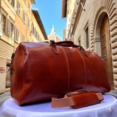 This Italian leather travel bag is expertly handcrafted in Florence, Italy, using the finest genuine leather. Designed for men seeking premium quality, luxury, and modern Italian fashion. Elevate your style with this exquisite accessory. . Size: Height: 30 cm (11.81 inches) Depth: 53 cm (20.87 inches) Width: 26 cm (10.24 inches) . The story of this travel bag: In the heart of Italy, where the rich legacy of craftsmanship thrives, there existed a renowned workshop dedicated to creating exquisite travel accessories. Among their coveted collection were the handmade duffle bags, carefully crafted to cater to the needs of discerning travelers seeking both style and functionality. These duffle bags, designed specifically as men's travel gear, embodied the essence of Italian travel bags. The arti Travel Bags For Men, Handmade Travel Bag, Luxury Travel Bag, Overnight Travel Bag, Mens Travel, Mens Travel Bag, Leather Travel Bag, Bags For Men, Leather Travel