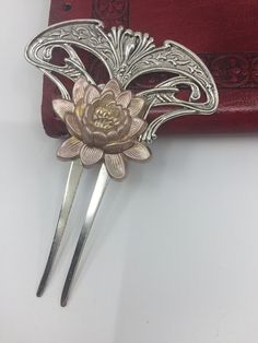 MyElegantThings By Angelina Verbuni Design Studio Art Nouveau style silver plated bronze Hair comb. This lovely baroque scroll hair comb is silver over brass. Rose is golden with the rose enameled over the brass component a dusty peach. Bold and Large this is a statement piece. You will love the high quality decorative comb, that holds the thickest and thinnest hair well. 4-1/2 x 3-1/2 inches Art Nouveau Hair Comb, Hair Comb Hairstyles, Afro Jewelry, Bridal Hair Ornaments, Rose Accessories, Dusty Peach, Decorative Hair Combs, Bronze Hair, Silver Hair Comb