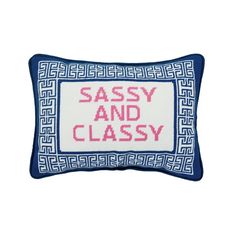 a blue and white pillow with the words sassy and classy in red on it