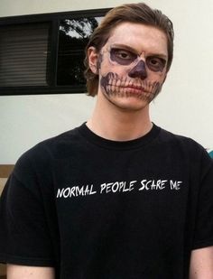 two men with fake skull faces and makeup on their face are standing next to each other