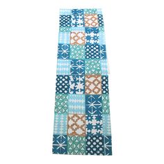 a blue and brown patchwork table runner