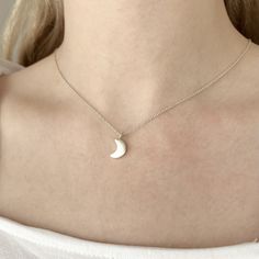 Sterling Silver Celestial Crescent Moon Charm Necklace  This necklace features the sweetest crescent moon charm on dainty but sturdy sterling silver cable chain. The charm is about 13mm long (including the loop) and about 7mm wide and it has a brushed texture for some subtle matte sheen. The charm is about 2mm thick so it has some nice depth to it and it slides freely along the chain for a simple minimalist design that would complement both casual and dressy outfits. Celestial jewelry is always in style so the necklace would be a perfect everyday accessory and it's charming on its own or layer it with others for a trendy look. The necklace is fastened with a sterling spring ring clasp and you can choose your desired length from the drop-down menu above.  You can find more celestial jewelry Lunar Jewelry, Crescent Moon Necklace Silver, Necklace Everyday, Celestial Necklace, Crescent Moon Necklace, Celestial Jewelry, Necklace Minimalist, Everyday Necklace, Silver Moon