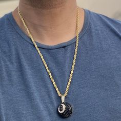 Men's iced black 8 ball hip hop chain. 14k yellow gold plated over alloy metal. 1 inch Eight Ball iced with dazzling stones. Chain measures 24" inches x 4 mm thick. Stylish & secure lobster claw clasp lock. Has a caged back for strong support. Solid weight to it at a 40 grams total. Shines so hard the stones will blind you. 100% FREE SHIPPING in USA. Order now! Gold Rope Chain Jewelry For Streetwear, Gold Rope Chain Jewelry, Black Jewelry With Adjustable Chain For Streetwear, Black Round Jewelry For Streetwear, Black Necklace With Adjustable Chain For Streetwear, Eight Ball, Hip Hop Chains, Gold Rope Chains, Rope Chain Necklace