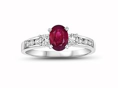 Ruby and Diamond Engagement Ring in 14k White Gold. This engagement ring has a 7x5mm oval Ruby in the center and has 0.40ctw of diamonds. Oval Ruby Ring In Platinum For Anniversary, Oval Ruby Ring With Platinum Center Stone, Oval Ruby Ring With Platinum Band, Oval Ruby Ring With Platinum, Oval Ruby Ring With Platinum Setting, Oval Three Stone Ruby Ring With Diamonds, Oval Ruby Ring With Three Diamonds, Platinum Three-stone Oval Rings, Platinum Three Stone Oval Rings