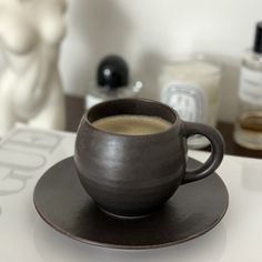 a cup of coffee sitting on top of a saucer