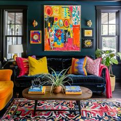 a living room filled with lots of colorful furniture and art on the wall above it