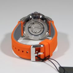 Item No. 98A226 Bulova Marine Star Silver Dial Orange Rubber Strap Men's Watch 98A226 Watch Features: Automatic Movement Caliber: 82S5 21 Jewels Stainless Steel Case Orange Rubber Strap Analog Display Silver Dial Luminous Hands Skeleton Dial Hack Feature Mineral Crystal Exhibition Case Back Buckle Clasp Case Diameter: 44mm Lug Width: 24mm Water Resistance: 200 Meters Free Priority Shipping on all orders in continental U.S. Shipping time is usually between 2 and 6 day's. 1 day handling time. Abou Orange Watches For Men, Orange Analog Watch With Round Dial, Bulova Super Seville, Luxury Red Analog Chronograph Watch, Bulova Computron, Bulova Accutron Astronaut, Orient Watch, Swiss Military, Gold Models