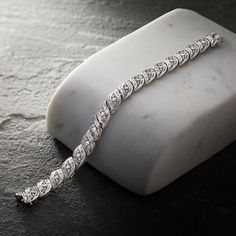 Ross-Simons - 1.00 ct. t. w. Diamond Bracelet in Sterling Silver. 8". Alight with 1.00 ct. t. w. baguette and round brilliant-cut diamonds, our twinkling bracelet is the epitome of elegance. Set in polished sterling silver, it's not only dazzling - it's affordable, too! Figure 8 safety. Box clasp, diamond bracelet. Diamond birthstones are the perfect gift for April birthdays. Diamond White Platinum Bracelet With Baguette Diamonds, Platinum Diamond Bracelet With Baguette Diamonds In Diamond White, Timeless Tennis Bracelet With Baguette Diamonds, Channel Set Round Cut Diamond Bracelet, Classic Silver Diamond Bracelet With Baguette Diamonds, Fine Jewelry Diamond White Diamond Bracelet With Channel Set, Classic Diamond White Tennis Bracelet With Baguette Diamonds, Diamond White Channel Set Diamond Bracelet, Timeless Baguette Diamond Bracelet For Anniversary